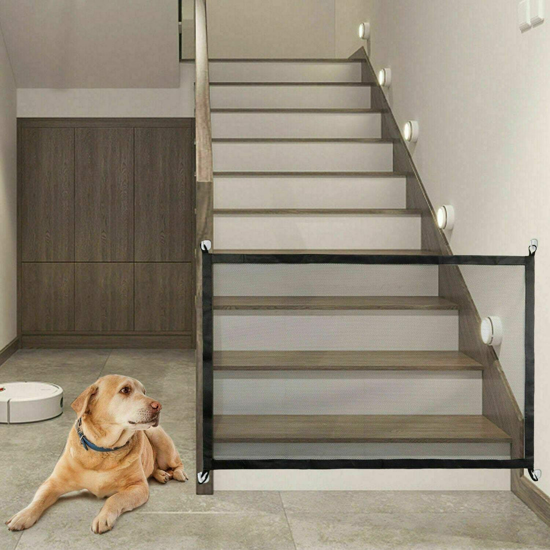 Dog and cat safety gate installed at the bottom of stairs, featuring black nylon mesh and stainless steel