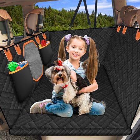 Dog car seat backrest in use with child and dog, featuring black 600D Oxford cloth and orange accents.